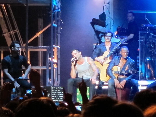 ricky martin with a band on stage in malaga